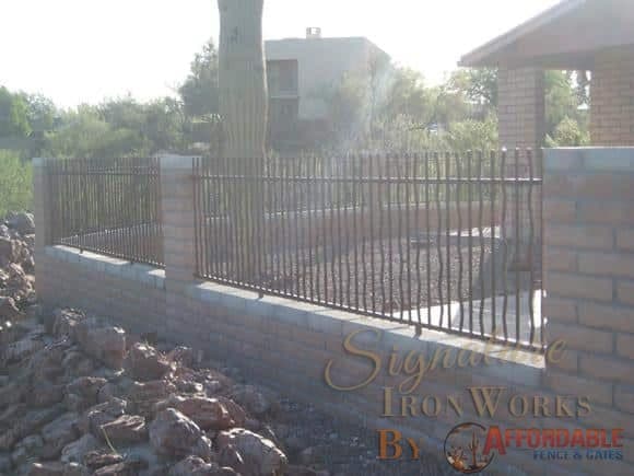 Wall-mounted rusted rebar iron fence IF302 Rebar - Installed in Tucson