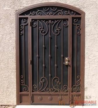 Security door with arched top and decorative knuckles and scrolls E909 - Made in Tucson