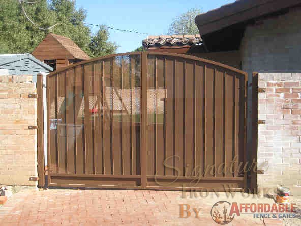 Arched top wrought iron gate with rust finish Tucson IG003