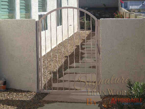 Arched top wrought iron gate with twisted pattern IG076