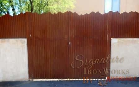 Affordable Fence & Gates | Signature Ironworks | Corrugated Steel Gate | Rusty Corrugated Steel Gate | Natural Rust Corrugated Steel Gate | Arch | Window Detail | Natural Rust Color