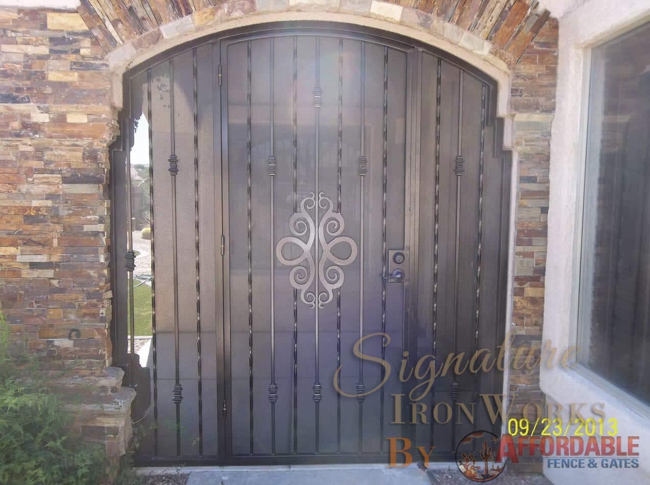 Patio enclosure with ornamental scroll work and alternate twist pattern 6001 E - Note the position of the security door behind the masonry wall. Made in Tucson
