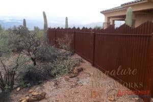 Corrugated Steel Fencing with Mountain Top Design | Rusted Metal Fence