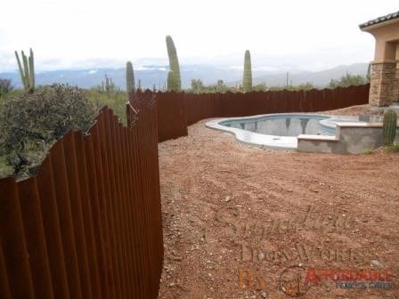 Corrugated Steel Fence with Mountain Top Design | Rusted Metal Fence