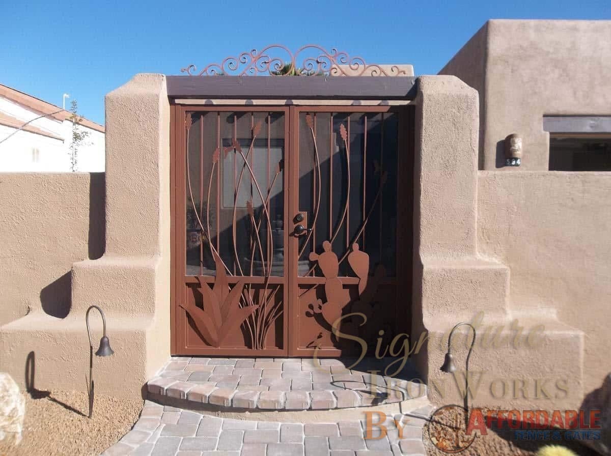 Double wrought iron gate with perforated metal backing - southwestern style with ocotillo, cacti, agave and hummingbird cutouts 100 0664