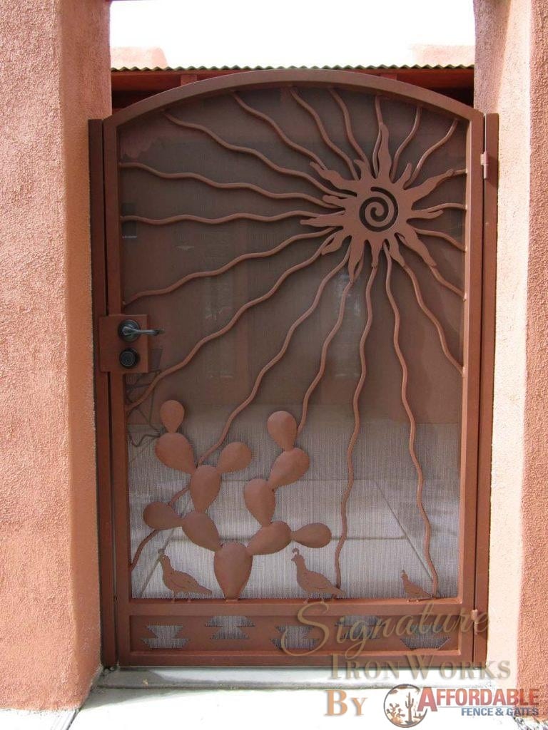 Southwestern Style iron gate with sun prickly pear cactus and quail