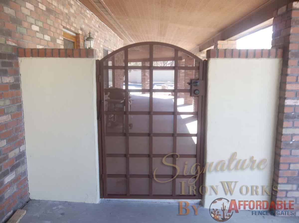 Wrought iron gate with a lattice structure and decorative clavos 100 0792 - Made in Tucson