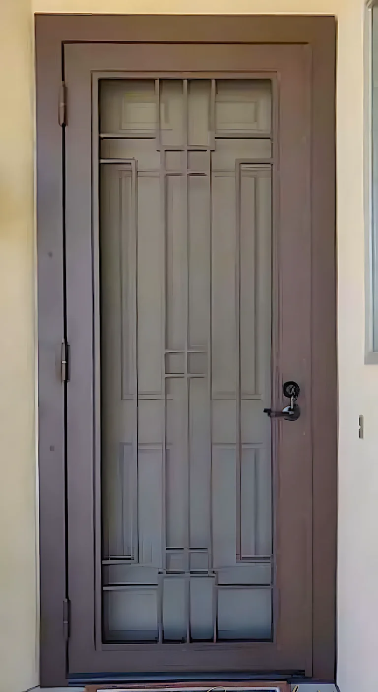 A brown security screen door with rectangular designs in the middle.